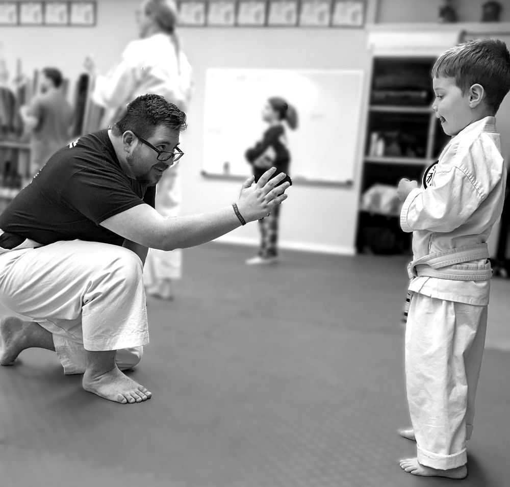 Alpha Martial Arts Academy instructor coaching a student